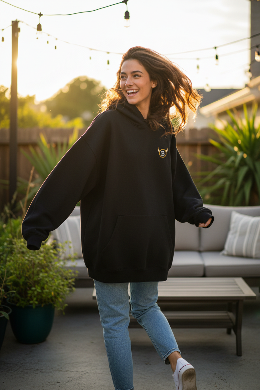 Her running away with the BabyBull hoodie, looking back giggling