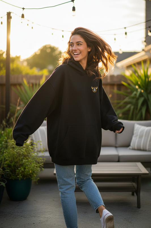 Her running away with the BabyBull hoodie, looking back giggling